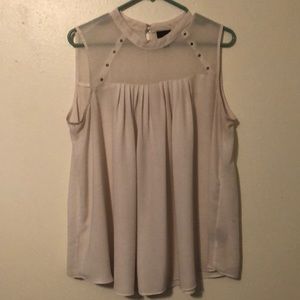 Cute blouse with a see through top.